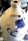 Narrow-necked stoneware jug with blue flower