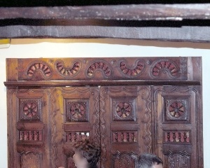 Detailed carving on doors of lit clos