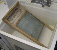 Washboard lying in sink