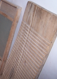 Wooden washboard, apparently hand-carved grooves